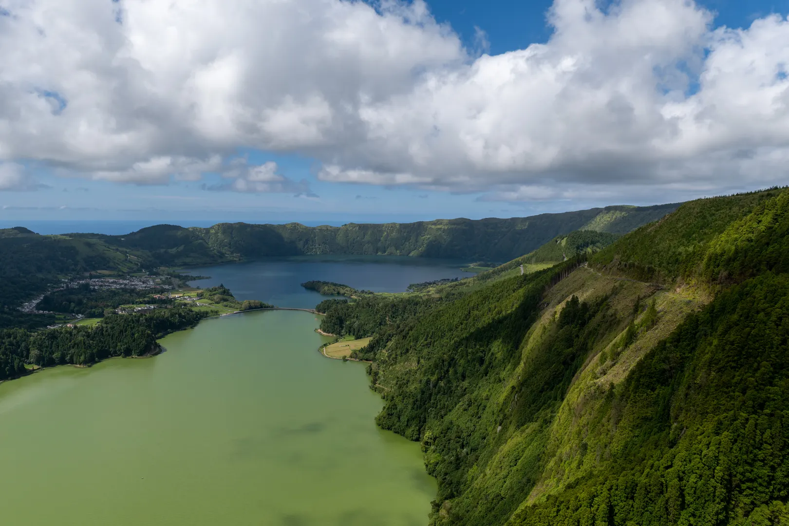 The green and blue crater lakes of Sete Cidades seen from the caldera rim